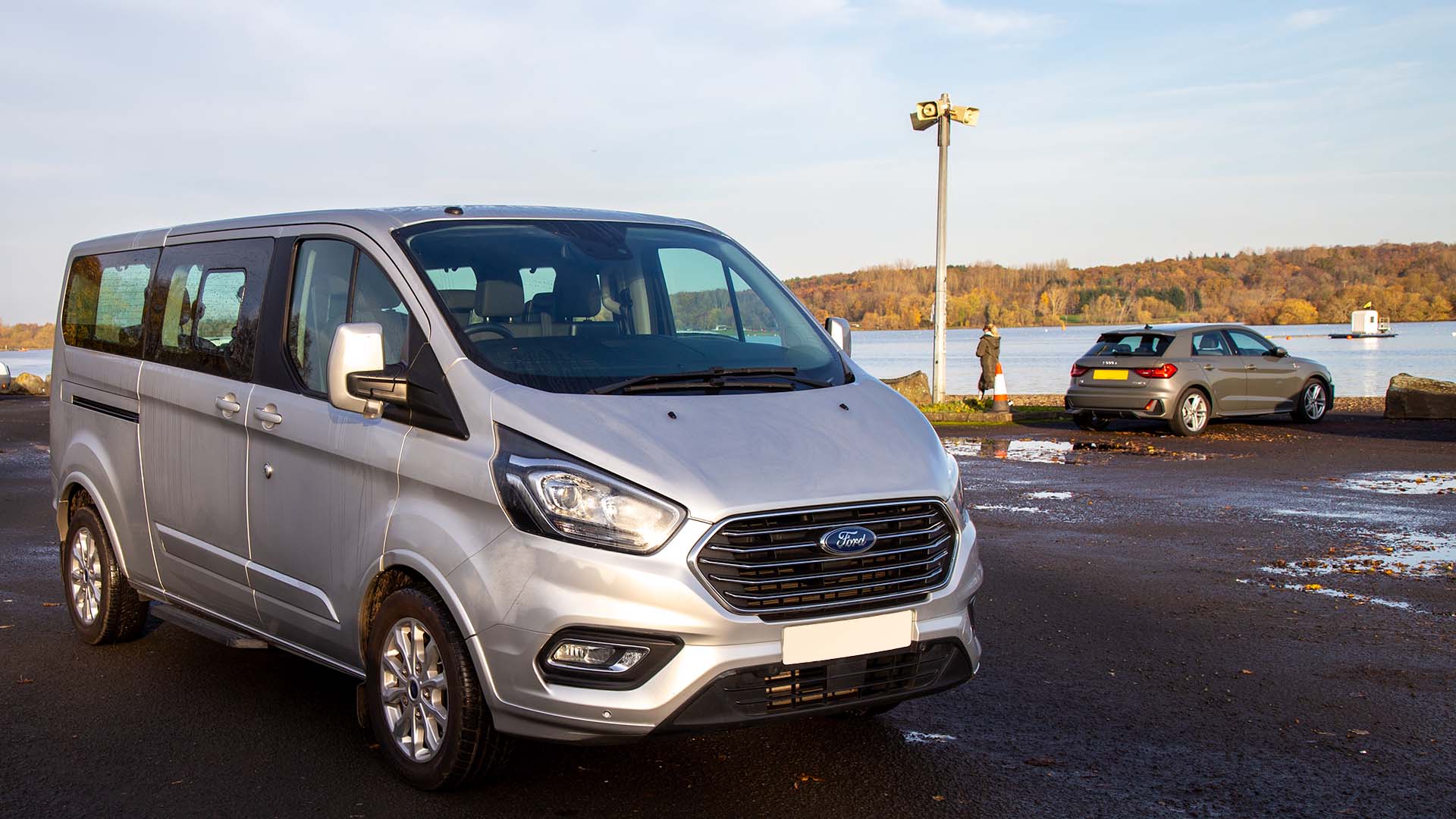 Luxury 8 seater minibus pictured in front of a loch